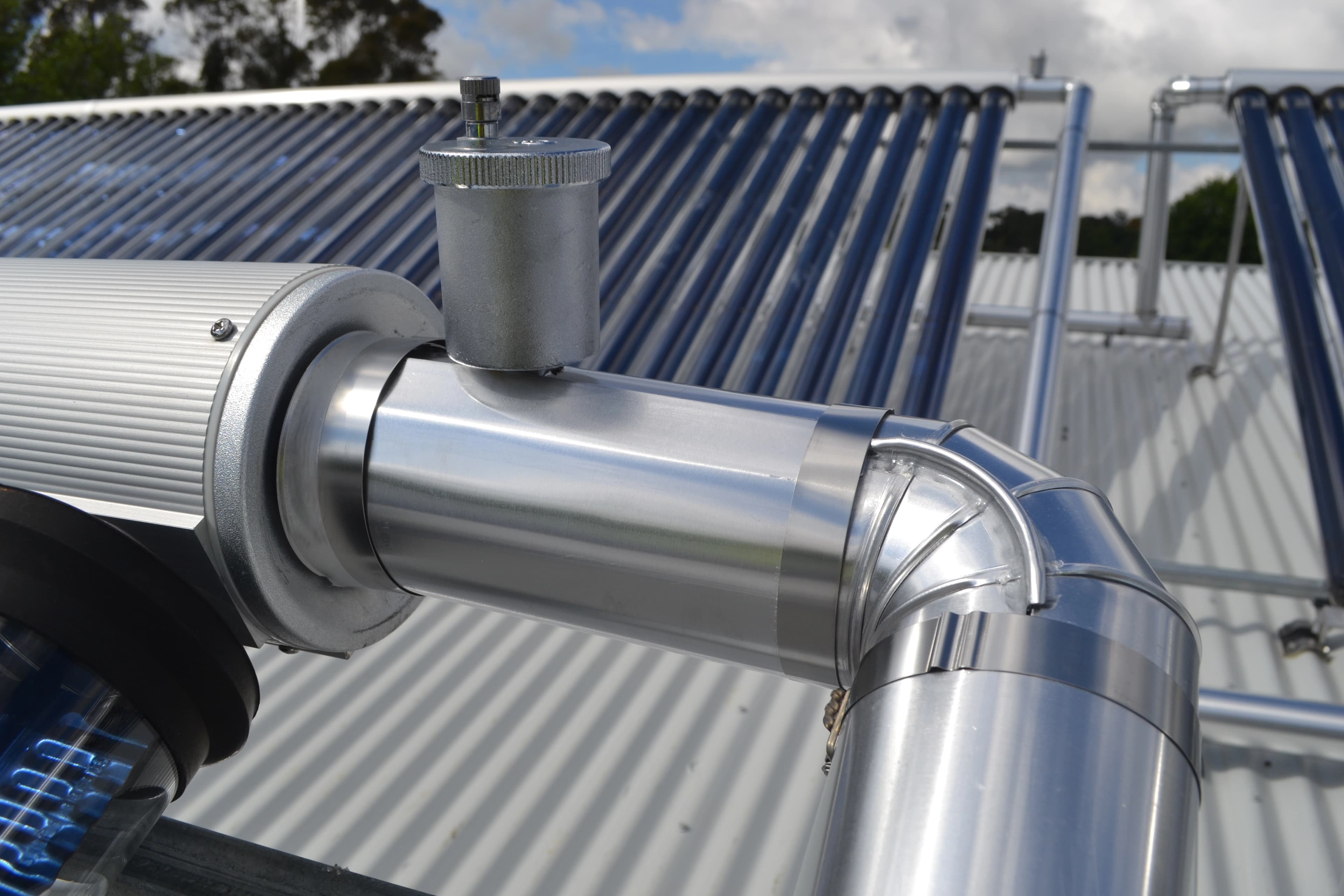 Close-up of outdoor silver pipe cladding